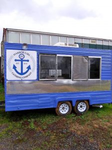 Harbor House Project blue trailer. Giving back to the community.